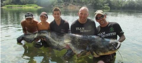 Group of men with a large catfish